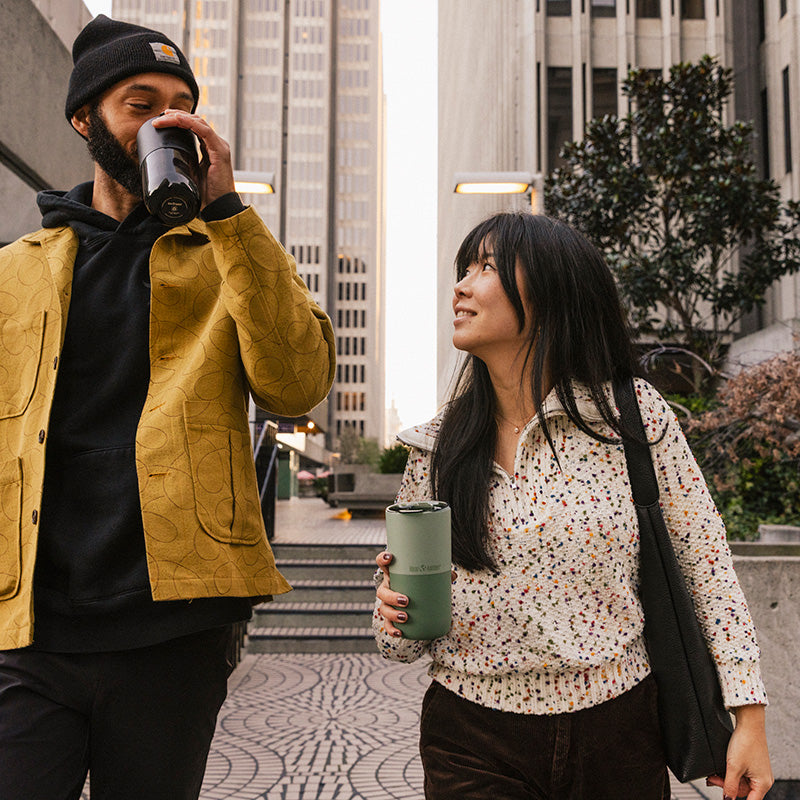 16oz-rise-tumbler-d9 16oz_rise_tumbler_black_iceberg_couple_drink_city_street_square.jpg