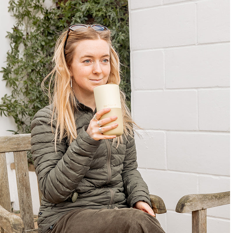 16oz-rise-tumbler-d9 16oz_rise_tumbler_wax_yellow_woman_seat_outside_square.jpg